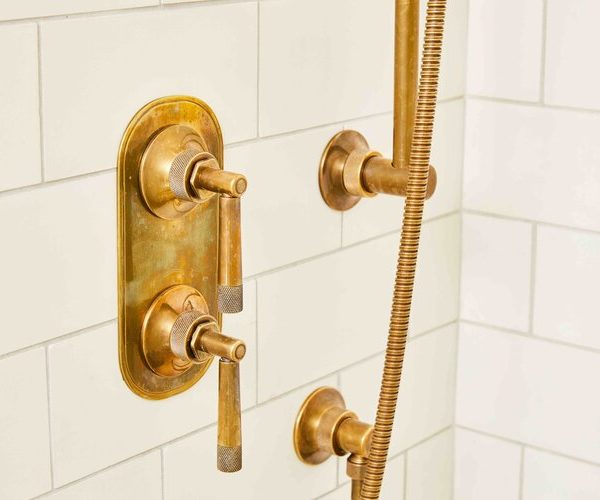 gold accent shower hardware South Shore project by Cabinet Plant